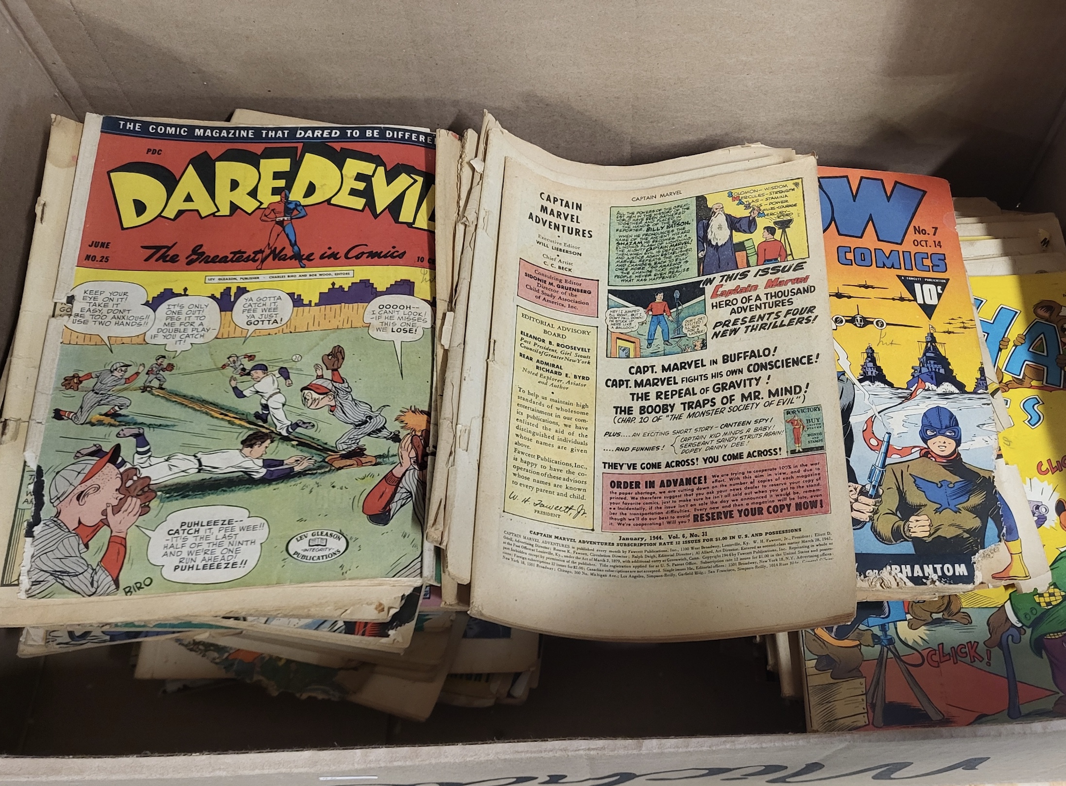 Vintage Golden Age comics including Daredevil, Captain Marvel Adventures, and Wow Comics